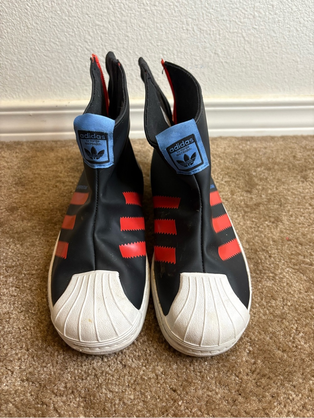 adidas Kids Black Slip-On Sneakers with Red Stripes and Blue Tongue Tabs
